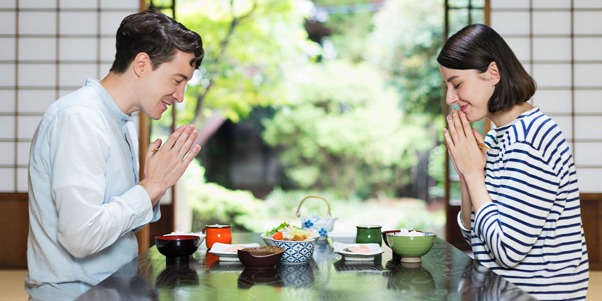 Two diners enjoying a Japanese meal in a traditional restaurant